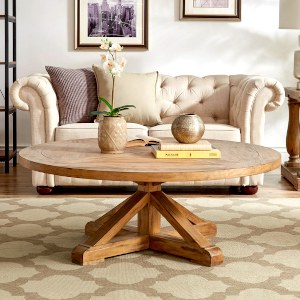 distressed-wood-brown-farmhouse-coffee-table-in-front-of-chesterfield-loveseat