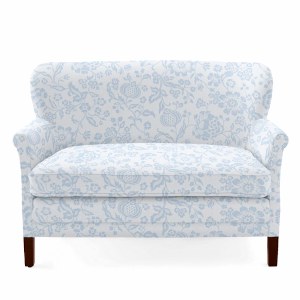 white petite corner love seat for a compact office space